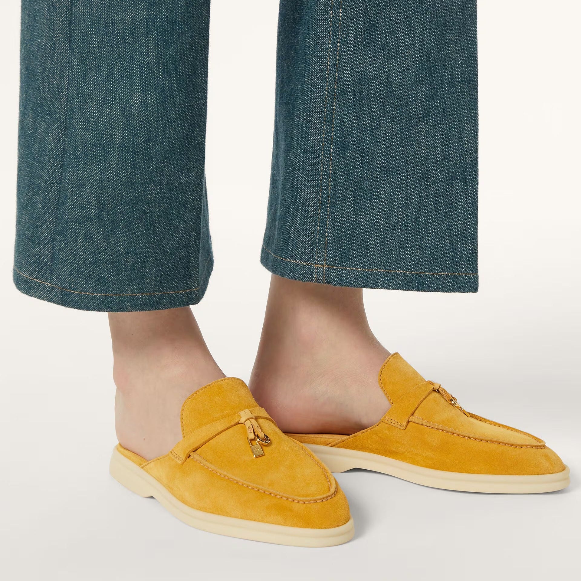 Yellow loafers worn with blue jeans 
